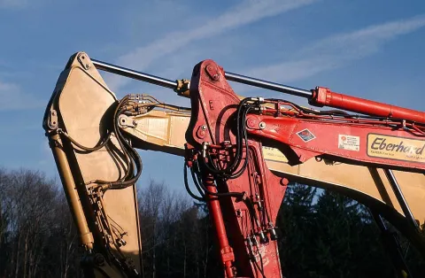 Excavator boom and hydraulic cylinders
