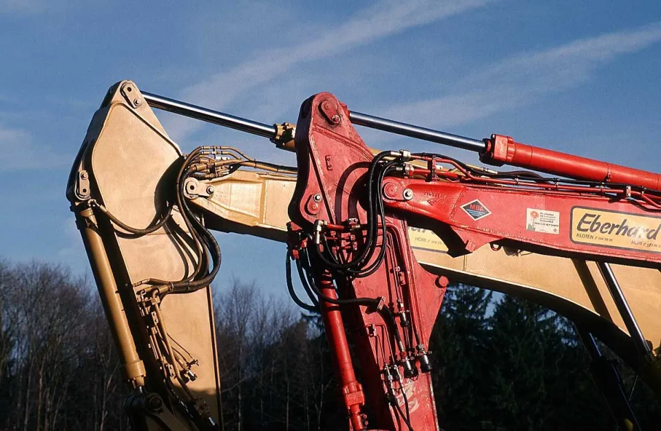 Excavator boom and hydraulic cylinders