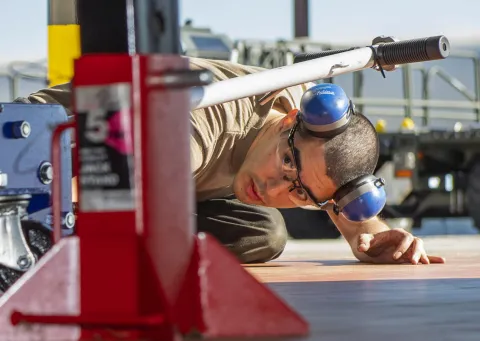 Mechanic servicing heavy equipment