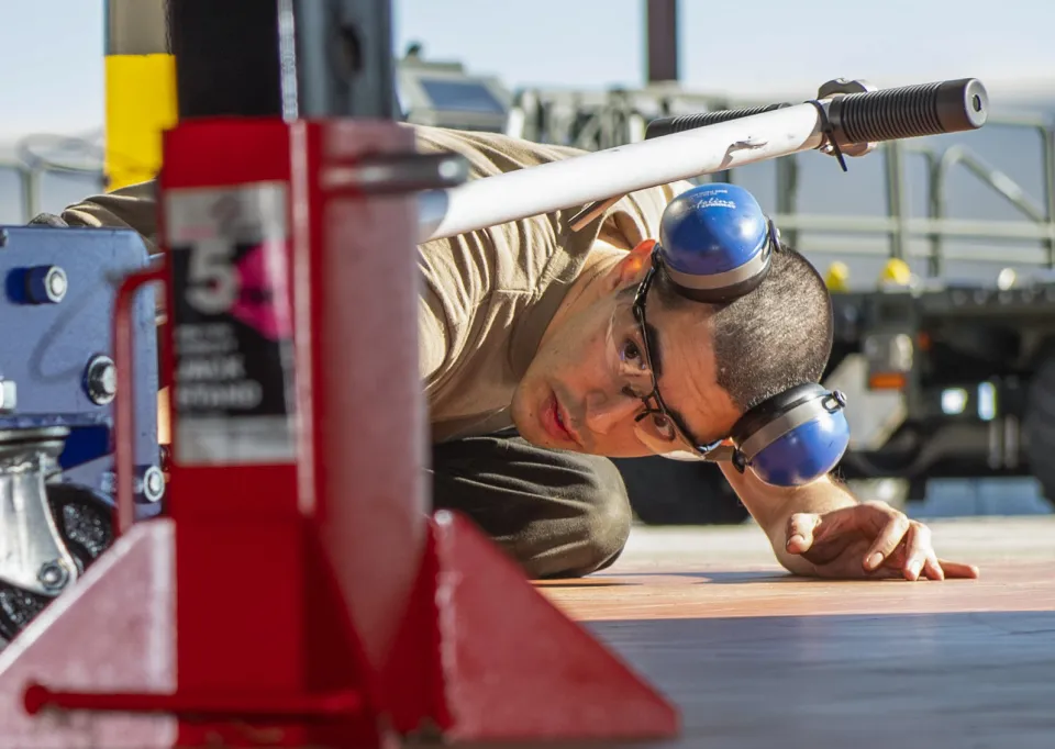 Mechanic servicing heavy equipment