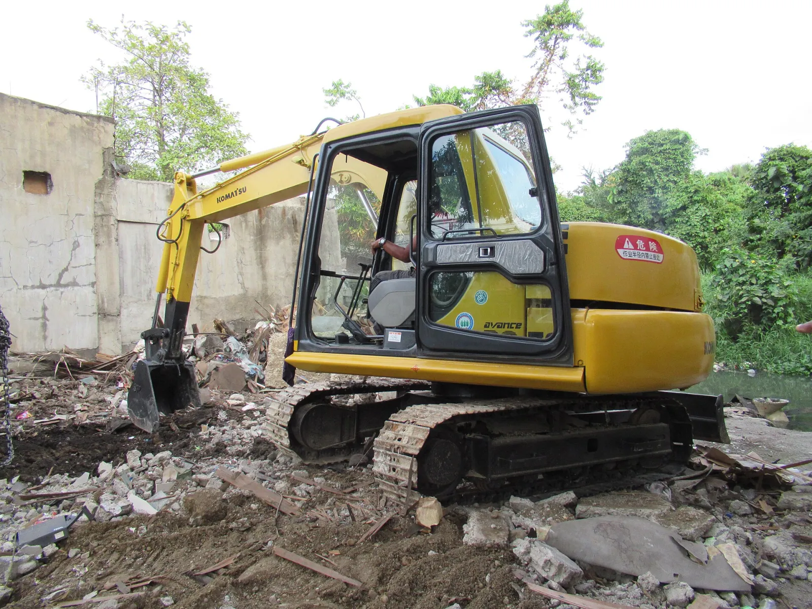 Excavator operator at work