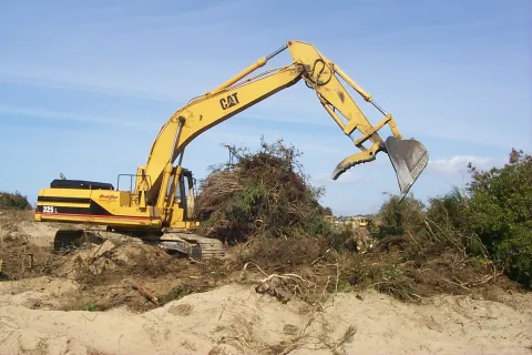 Excavator digging with its bucket