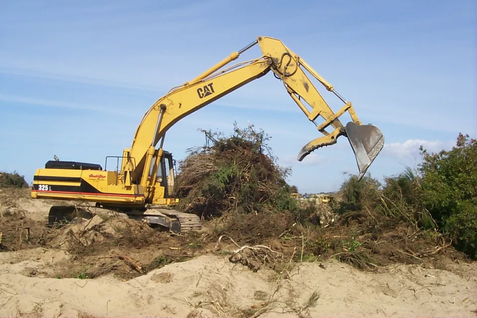 Excavator digging with its bucket