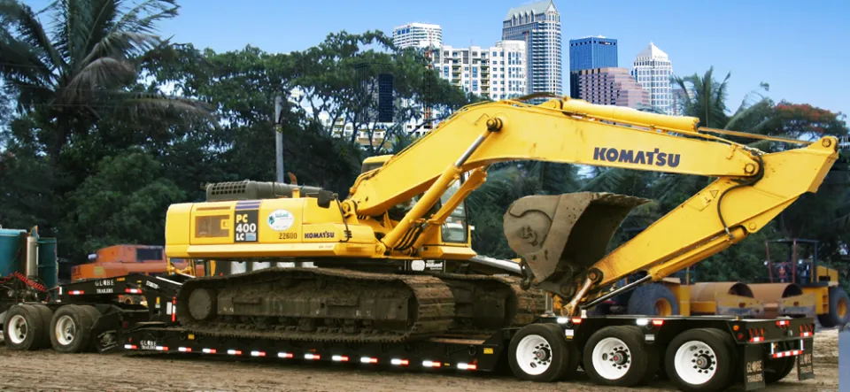 Excavator loaded on a lowboy trailer