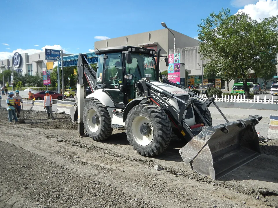 Backhoe loader working on a street project