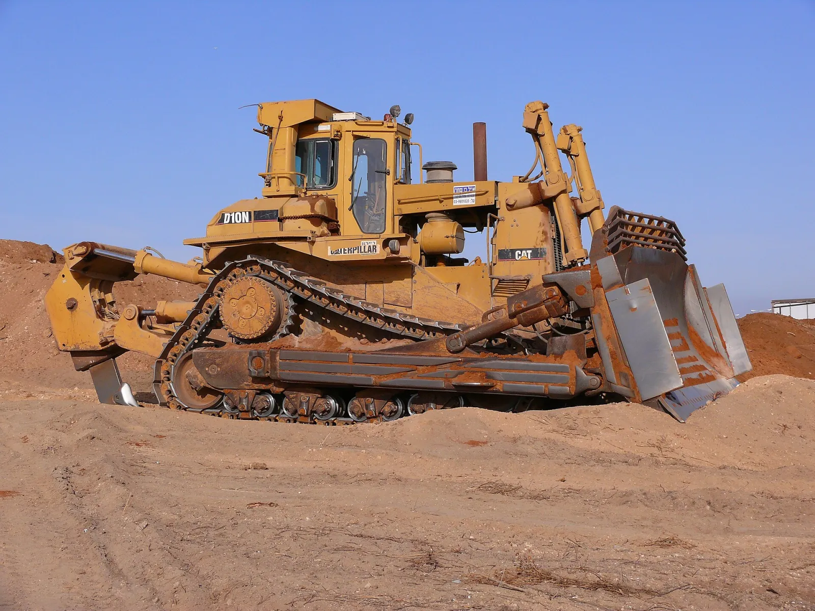 Crawler bulldozer pushing soil