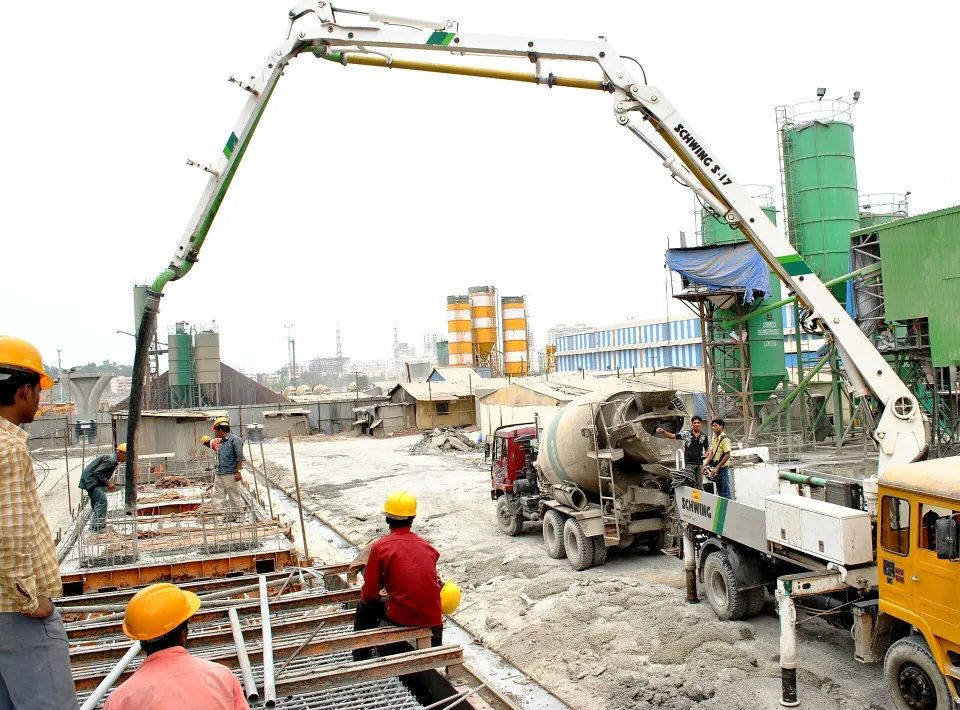 Truck-mounted concrete pump placing concrete