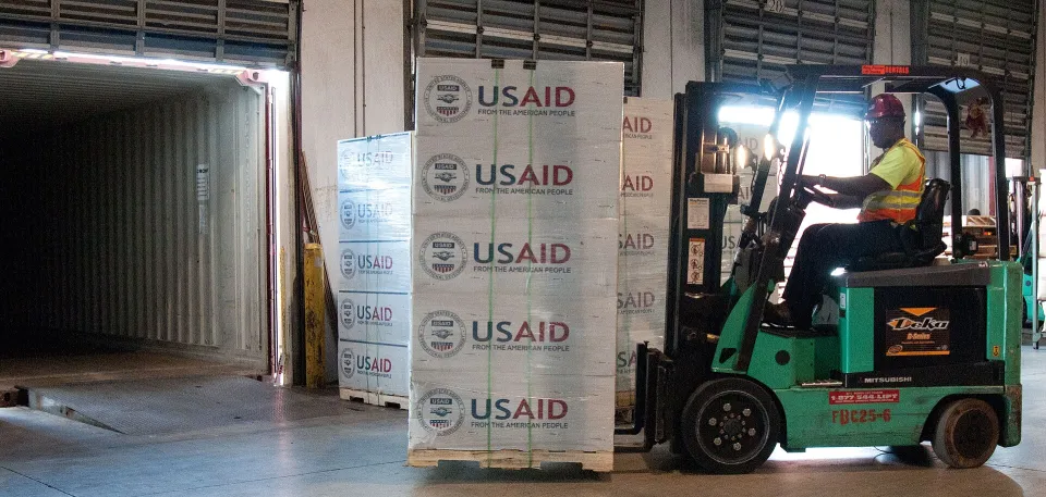Forklift moving pallets in a warehouse