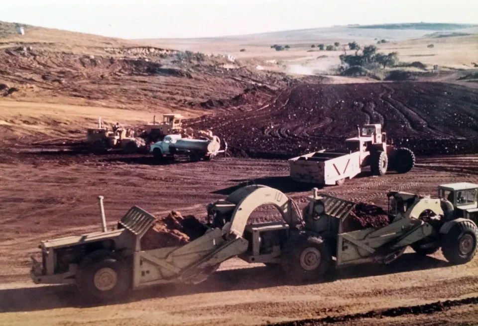 Wheel tractor-scrapers working on a large earthmoving site