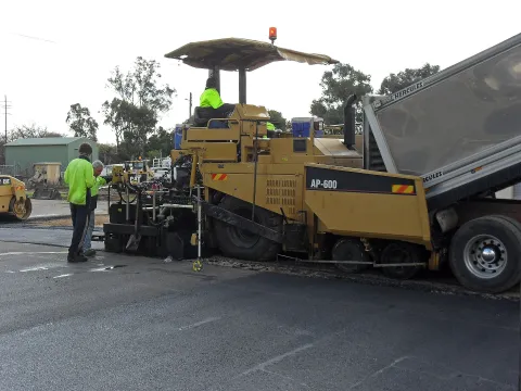 Asphalt paver laying a new road surface
