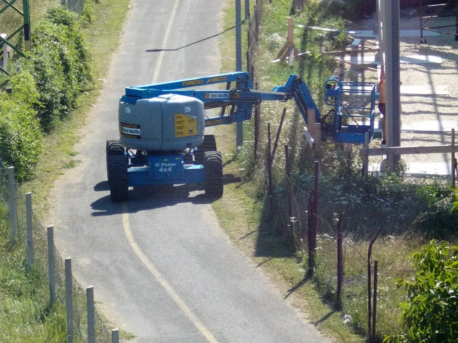 Genie articulating boom lift on a construction site