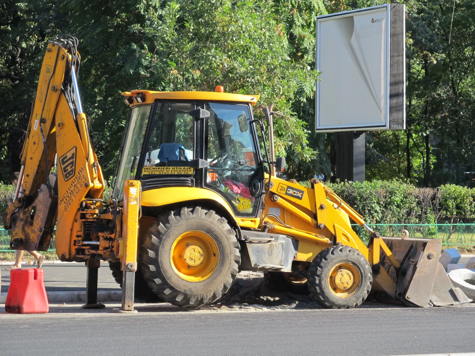 JCB 3CX backhoe loader standing on its stabilisers