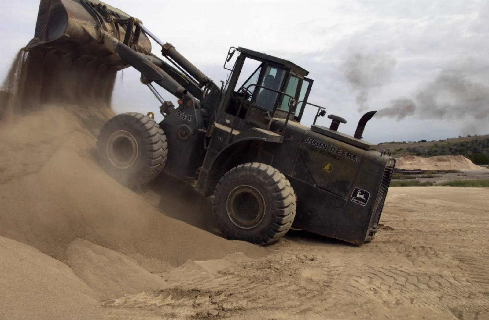 John machine similar to the John Deere 844 P-Tier (related model may be pictured)