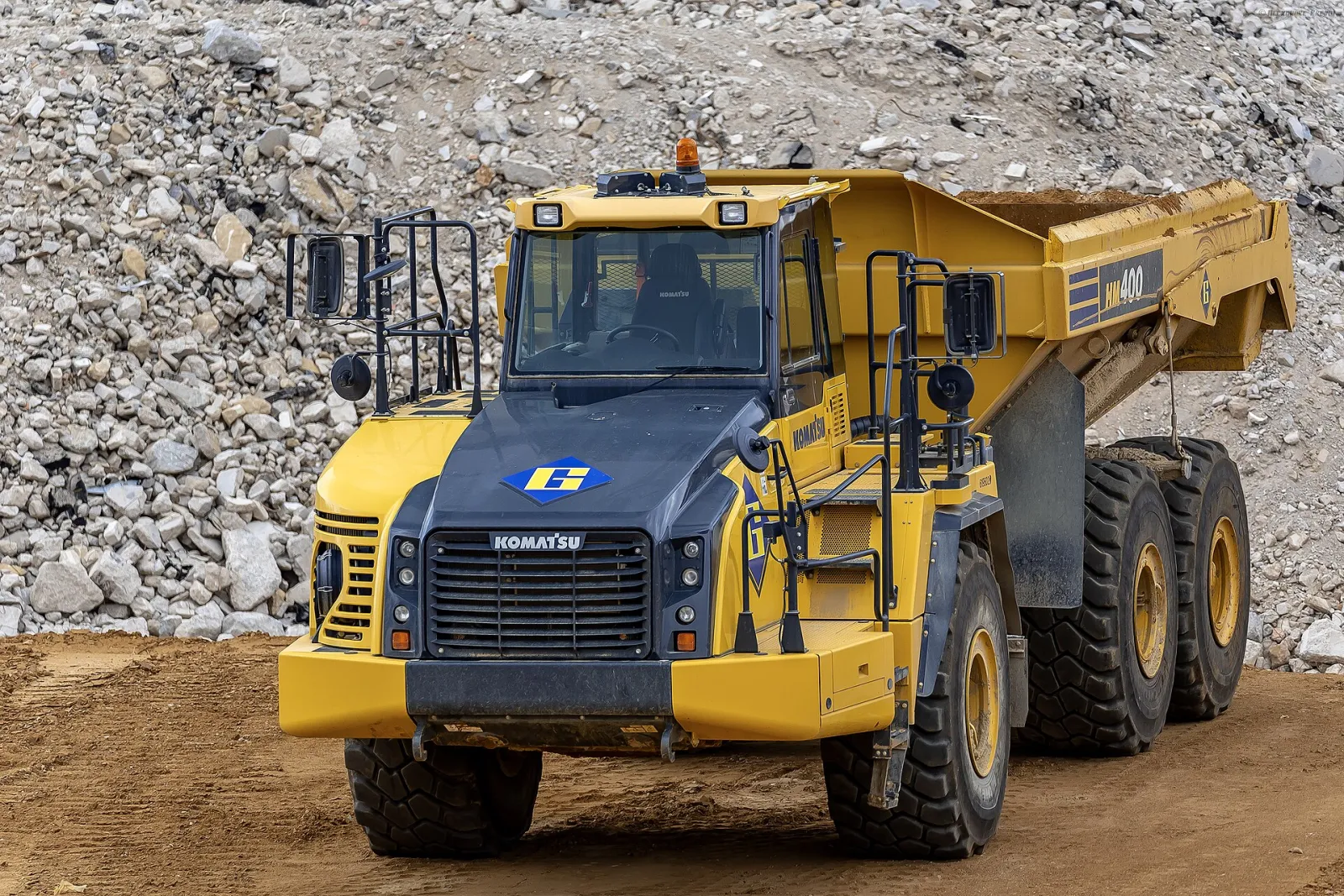 Komatsu HM400 articulated dump truck in a quarry