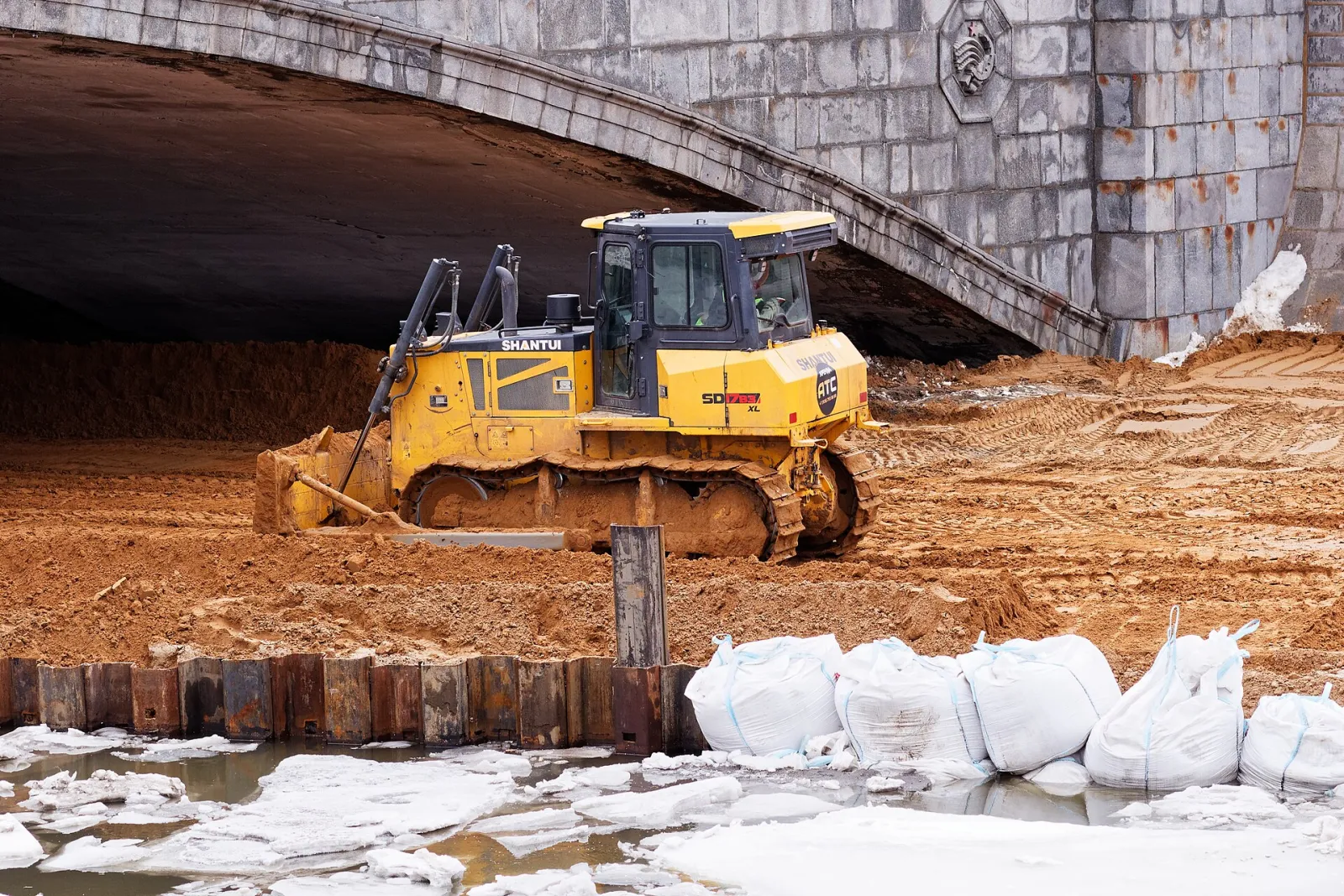 Shantui bulldozer on an embankment construction site