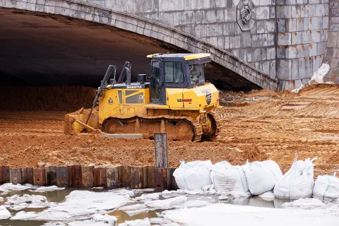 Shantui bulldozer on an embankment construction site
