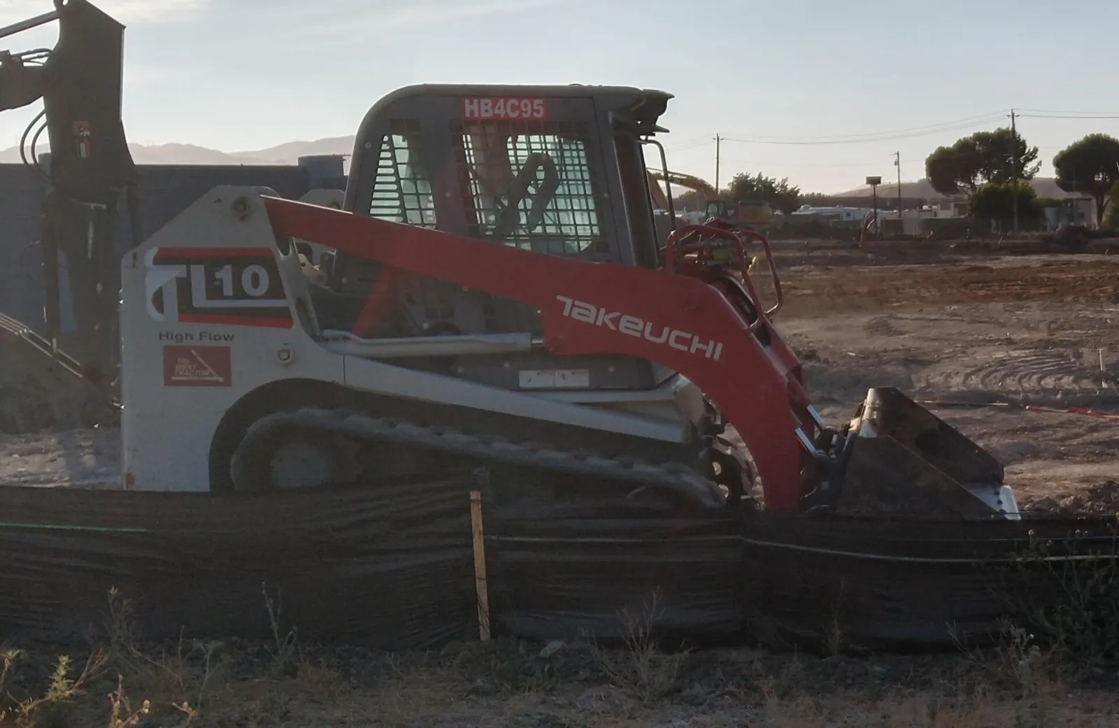 Takeuchi machine similar to the Takeuchi TL10V2 (related model may be pictured)