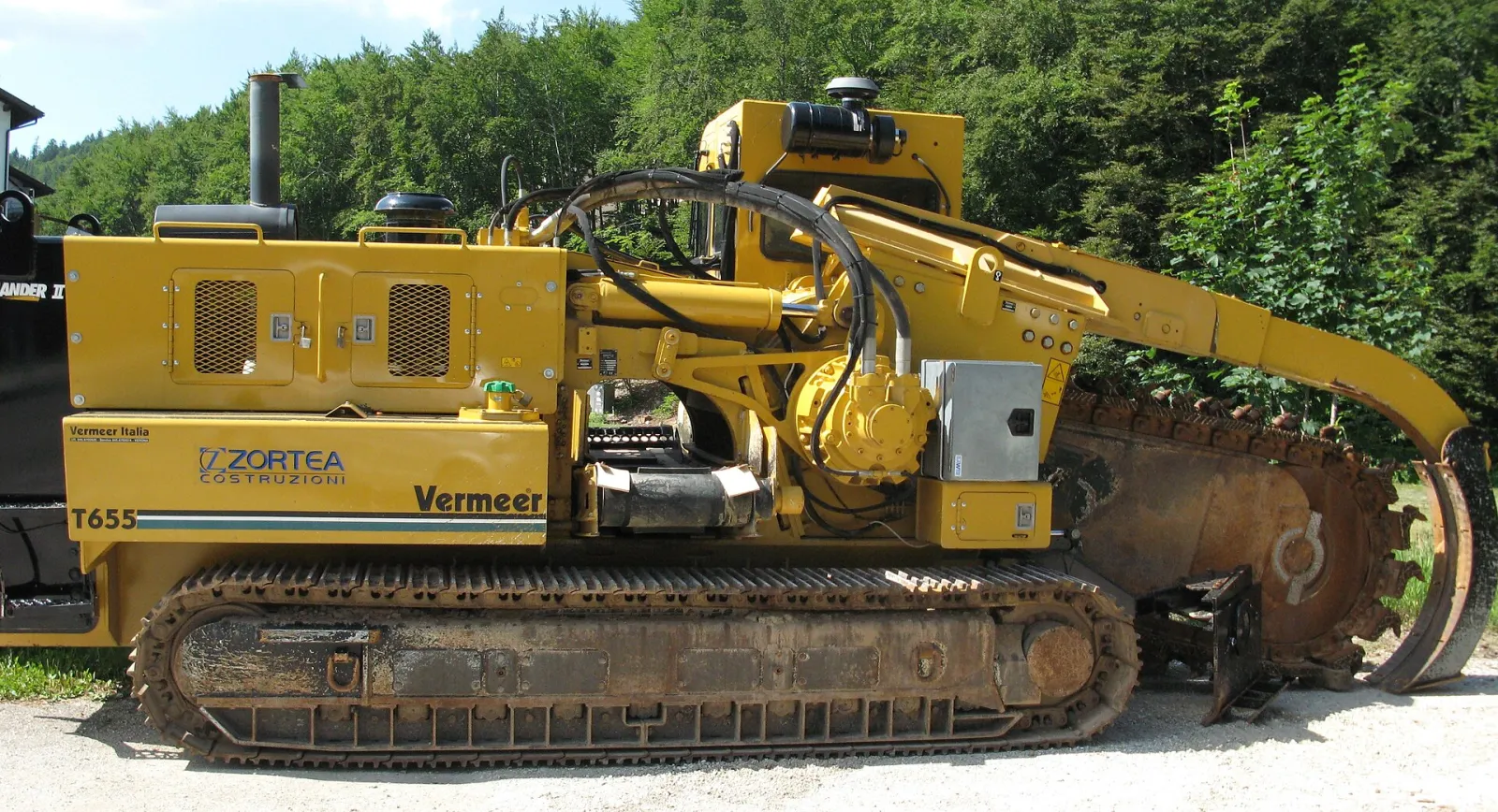 Track trencher with a digging chain